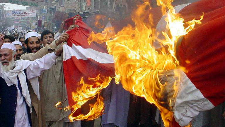 Karikaturen, die ein Protest-Feuer entfachten